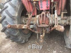 Massey Ferguson 575 with loader bucket and counterweight and PTO transmission